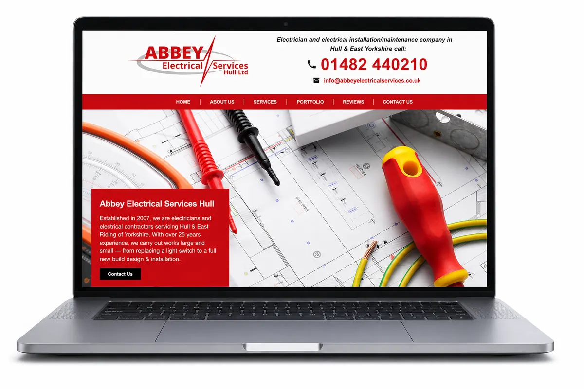 Laptop showing the Abbey Electrical Services website